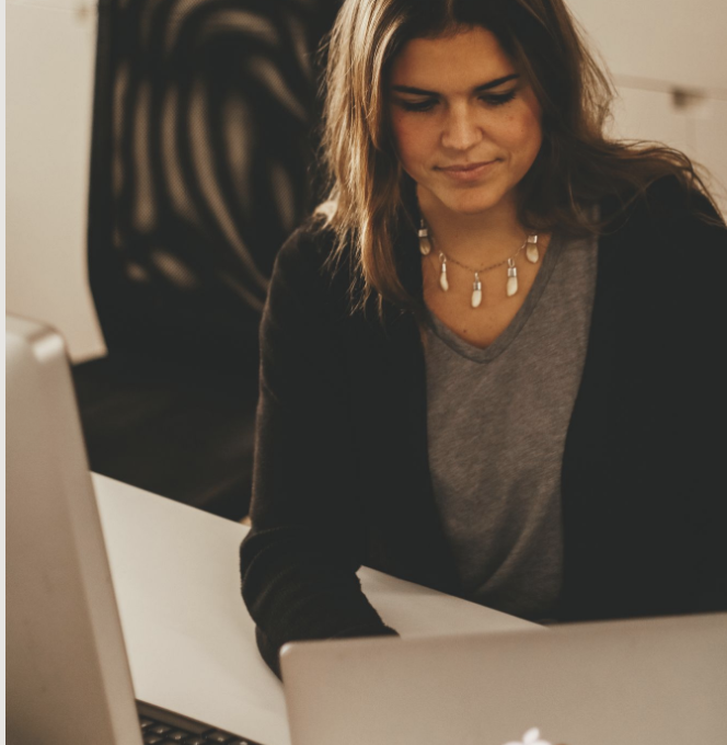 Olga Pla working as a graphic and creative designer.